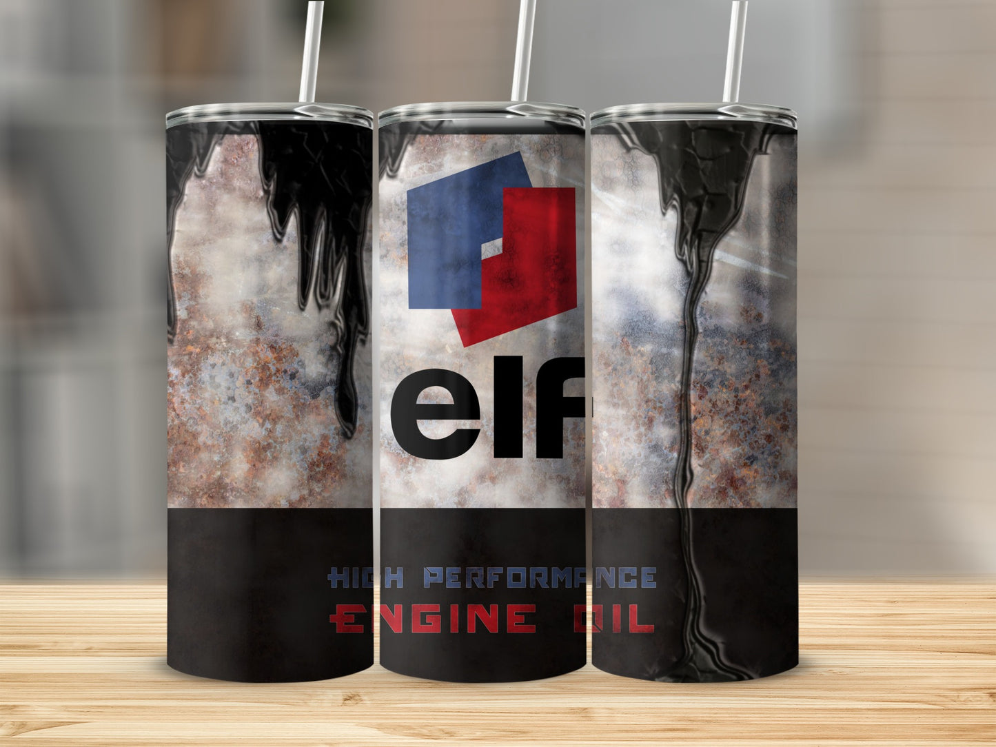 Tall tumbler with Elf logo and "High Performance Engine Oil" text.