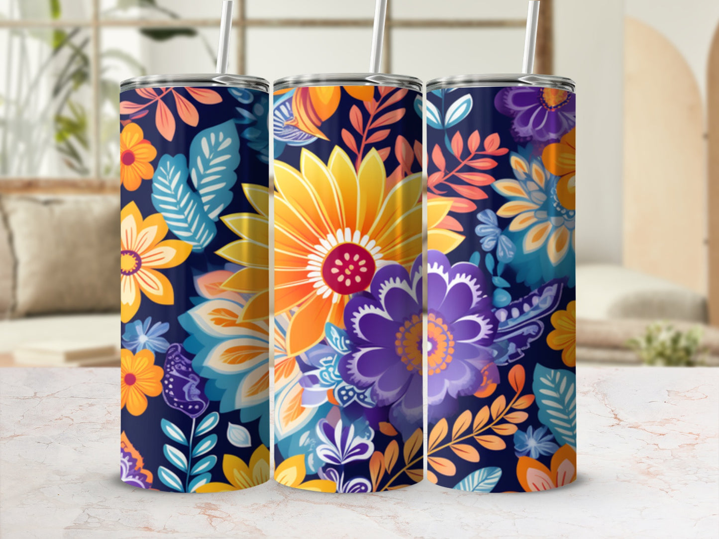 Three tumblers with a vibrant floral pattern on a dark blue background.