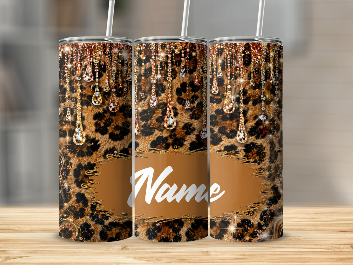 Three tumblers with leopard print, gold glitter, and diamond drop designs.