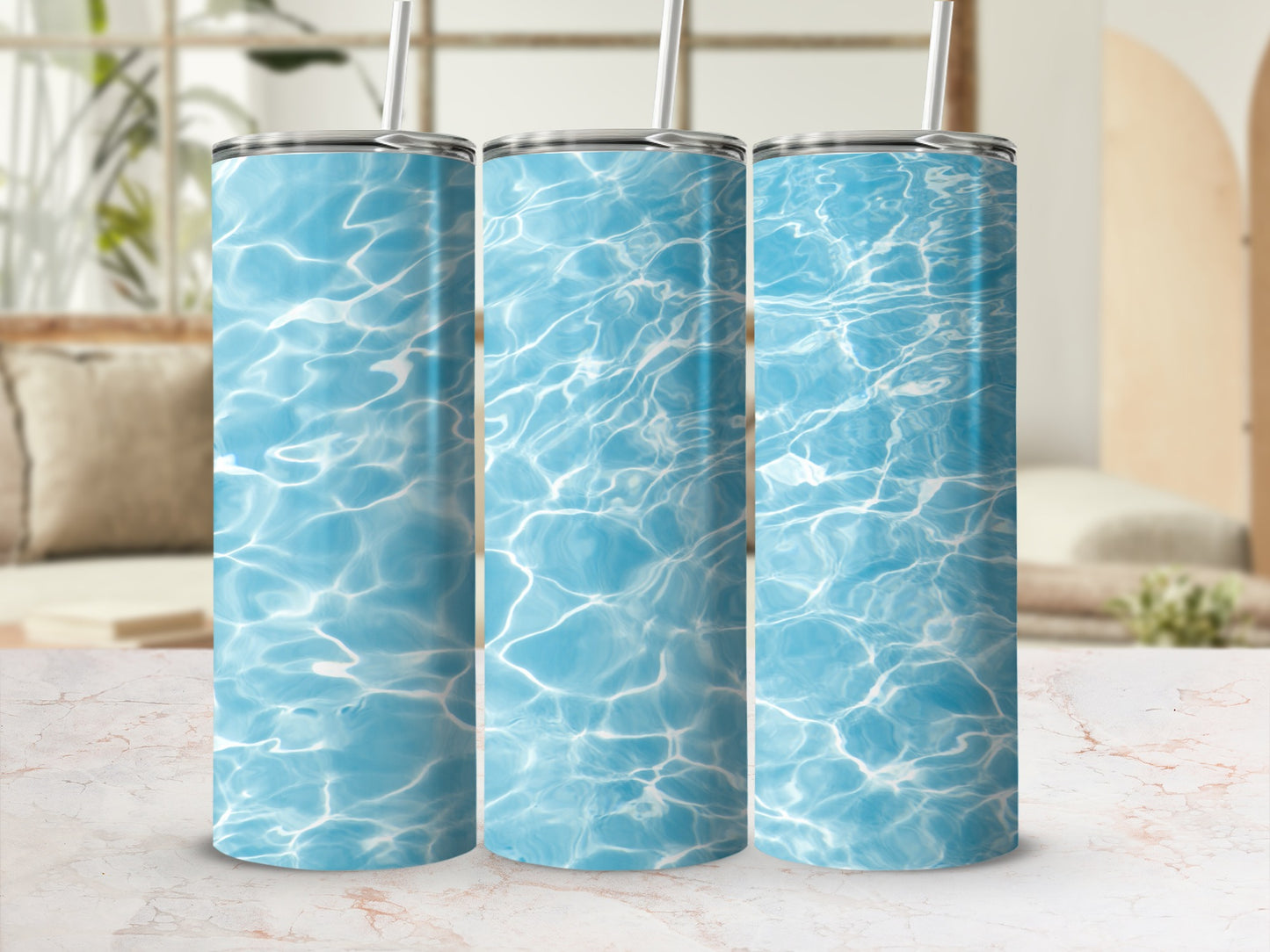 Three tumblers with a blue water ripple pattern and straws.