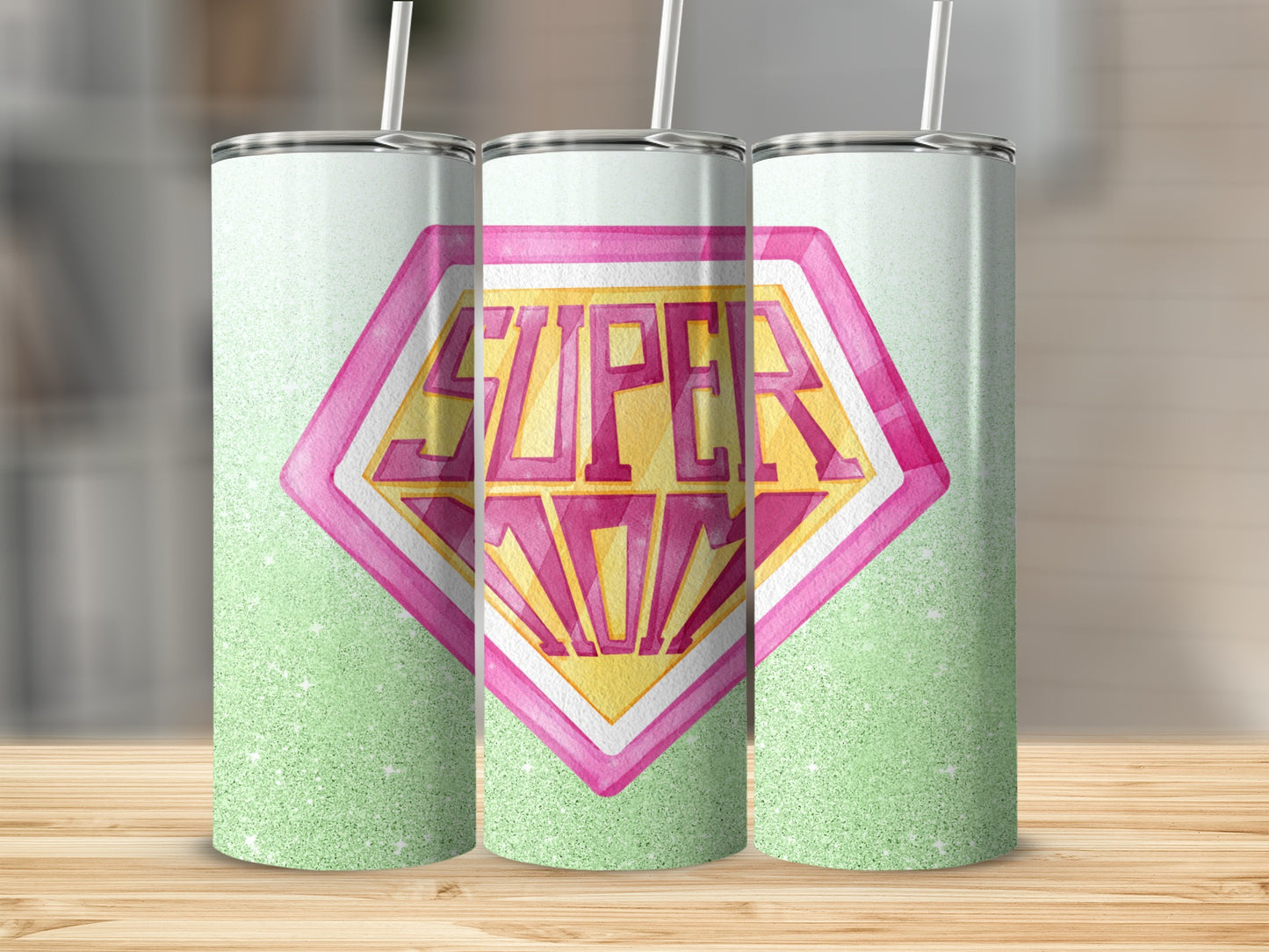 Superhero "Super Mom" logo on a green glitter tumbler.