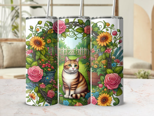 Tabby cat sitting in a garden surrounded by flowers and roses.