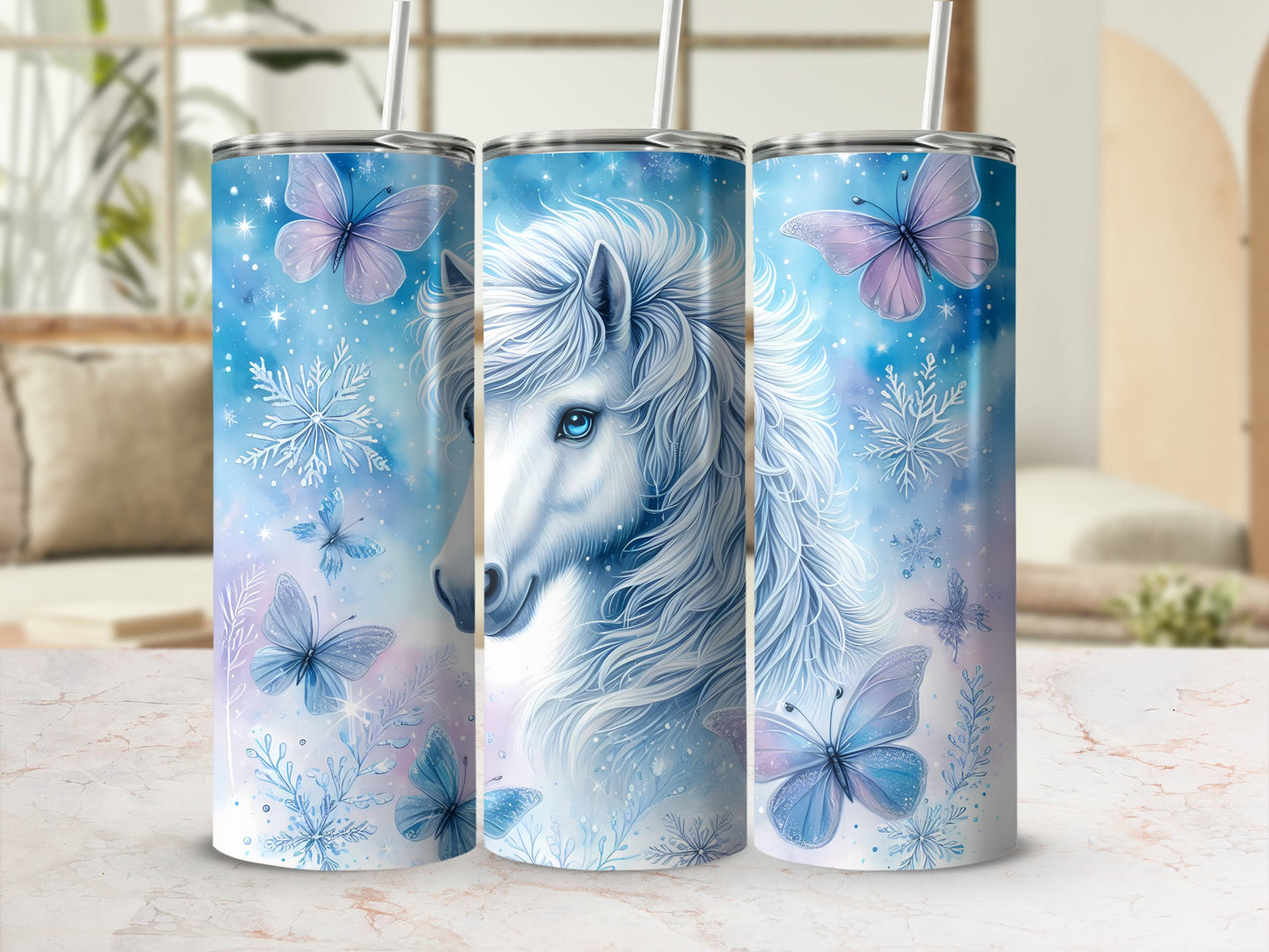 Blue watercolor unicorn with butterflies and snowflakes on a tumbler.