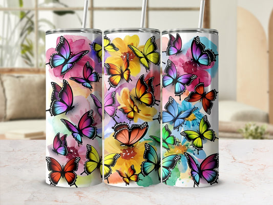 Three tumblers decorated with colorful watercolor butterflies.