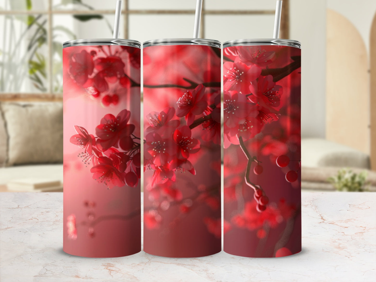 Three tumblers with a close-up of red cherry blossoms on a blurred background.