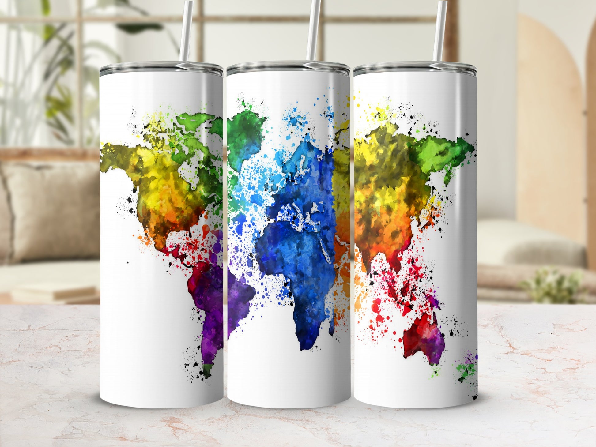 Three white tumblers featuring a colorful watercolor world map design.