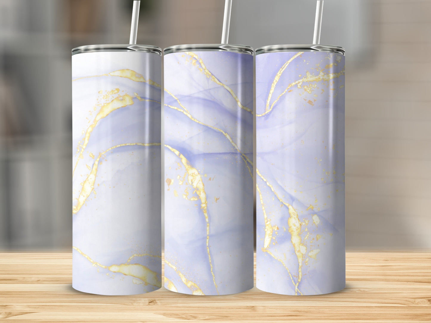 Three tall tumblers with abstract watercolor and gold marble patterns.