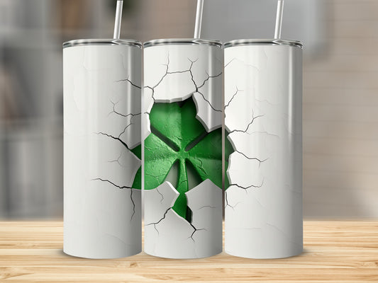 Three white tumblers with cracked exteriors revealing a green shamrock.