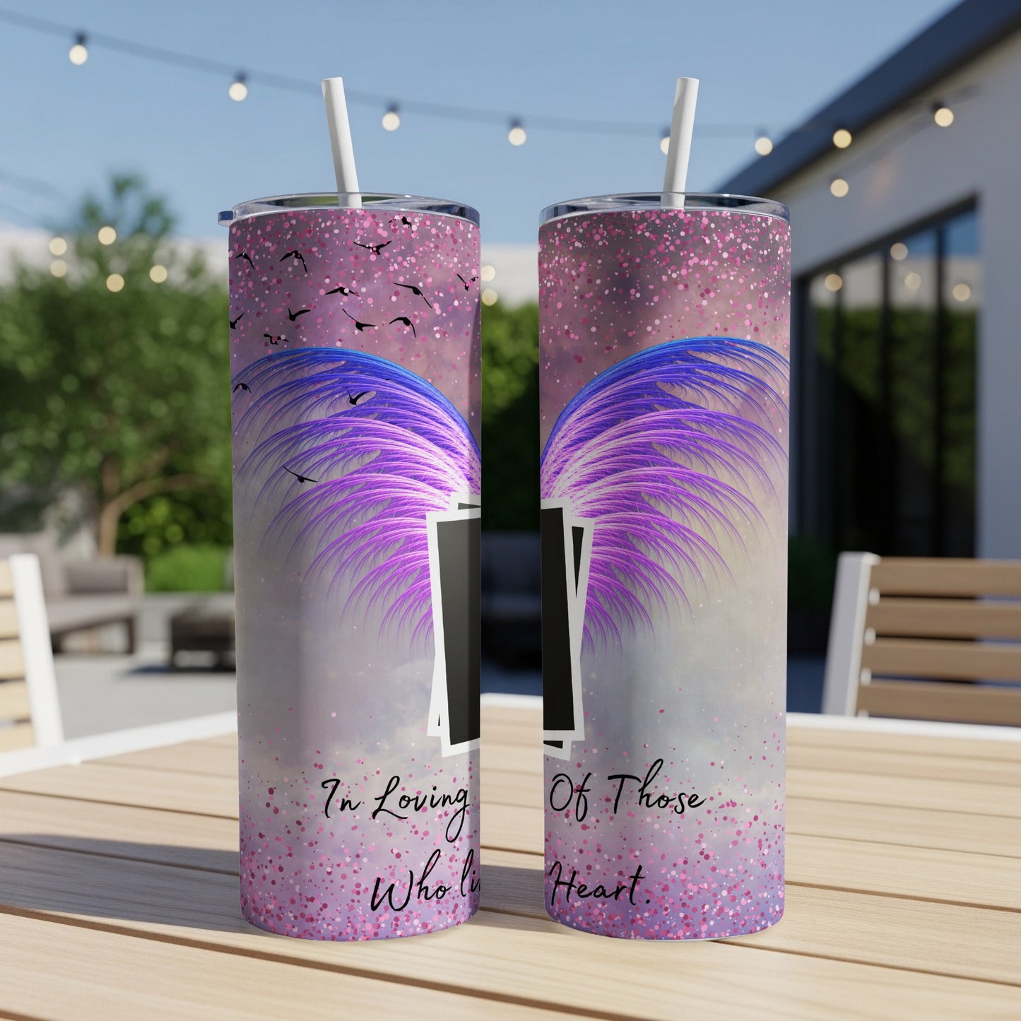 Two tumblers with purple wings and birds design, and text "In Loving Who lives in Heart".