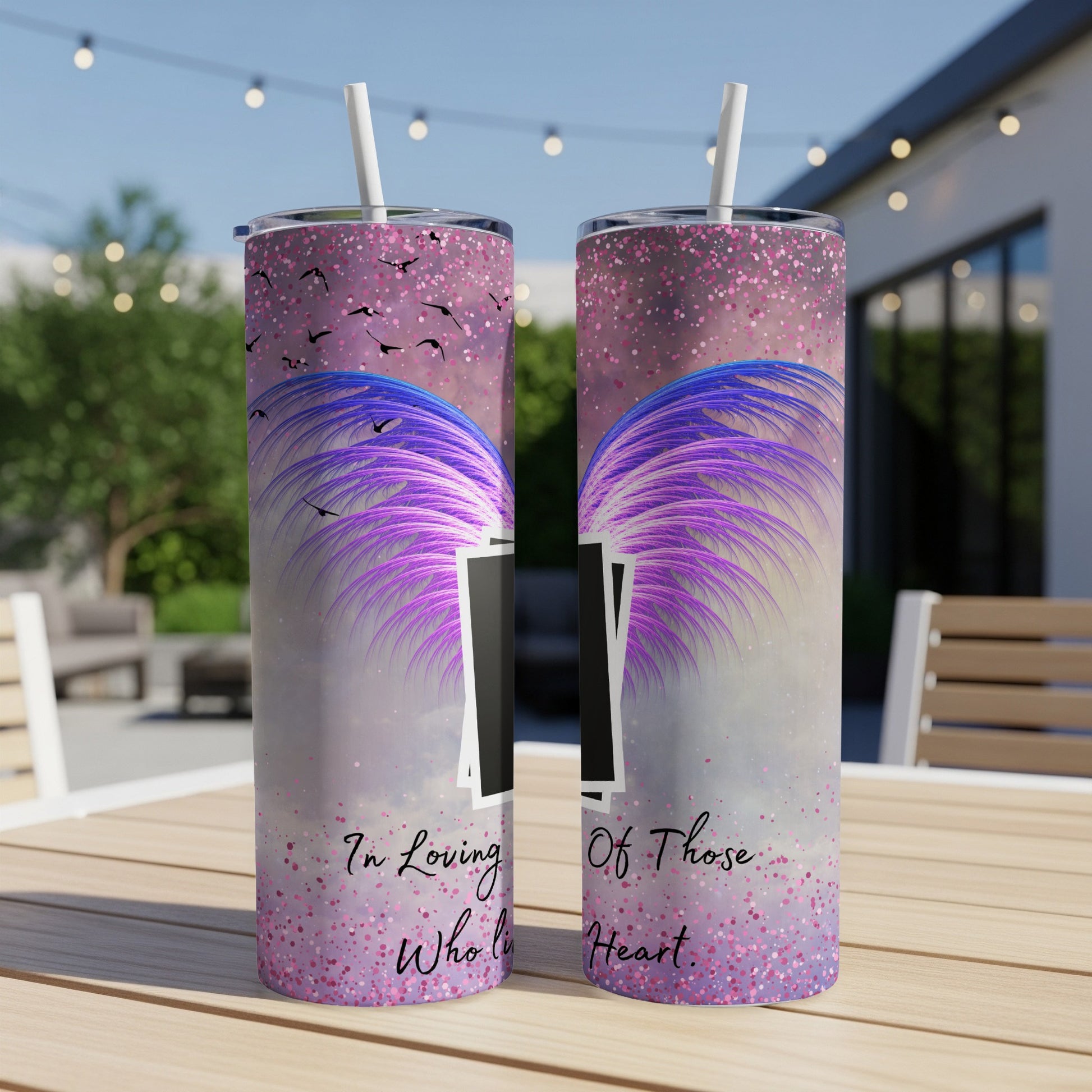 Two tumblers with purple wings and birds design, and text "In Loving Who lives in Heart".