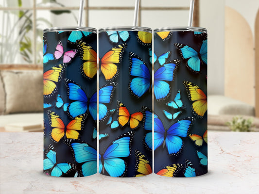 Three tumblers decorated with colorful butterfly patterns.