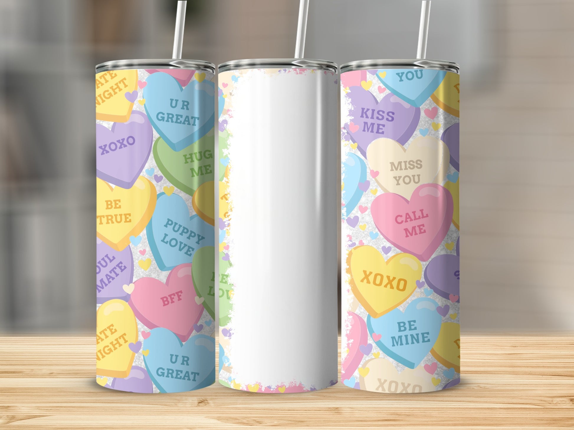 Three tumblers with conversation heart designs: "XOXO", "UR GREAT", and "BE MINE".
