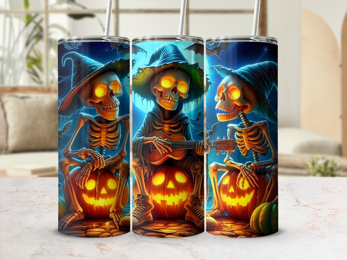 Three Halloween tumblers feature skeletons wearing witch hats with glowing eyes, sitting on pumpkins.