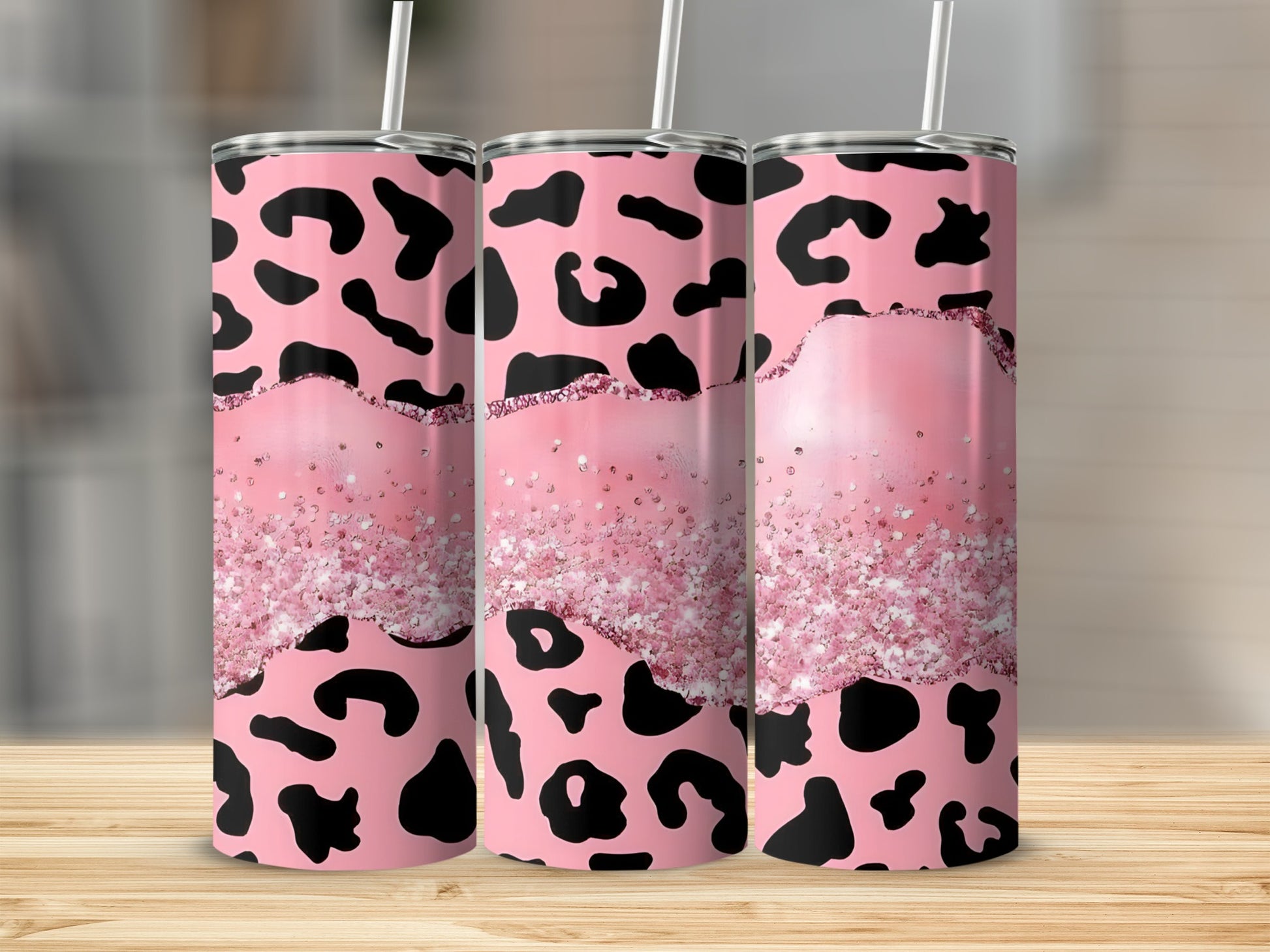 Pink leopard print tumbler with glitter accent detail.