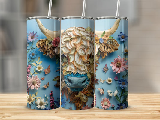 Three skinny tumblers with a Highland cow adorned with flowers and butterflies.