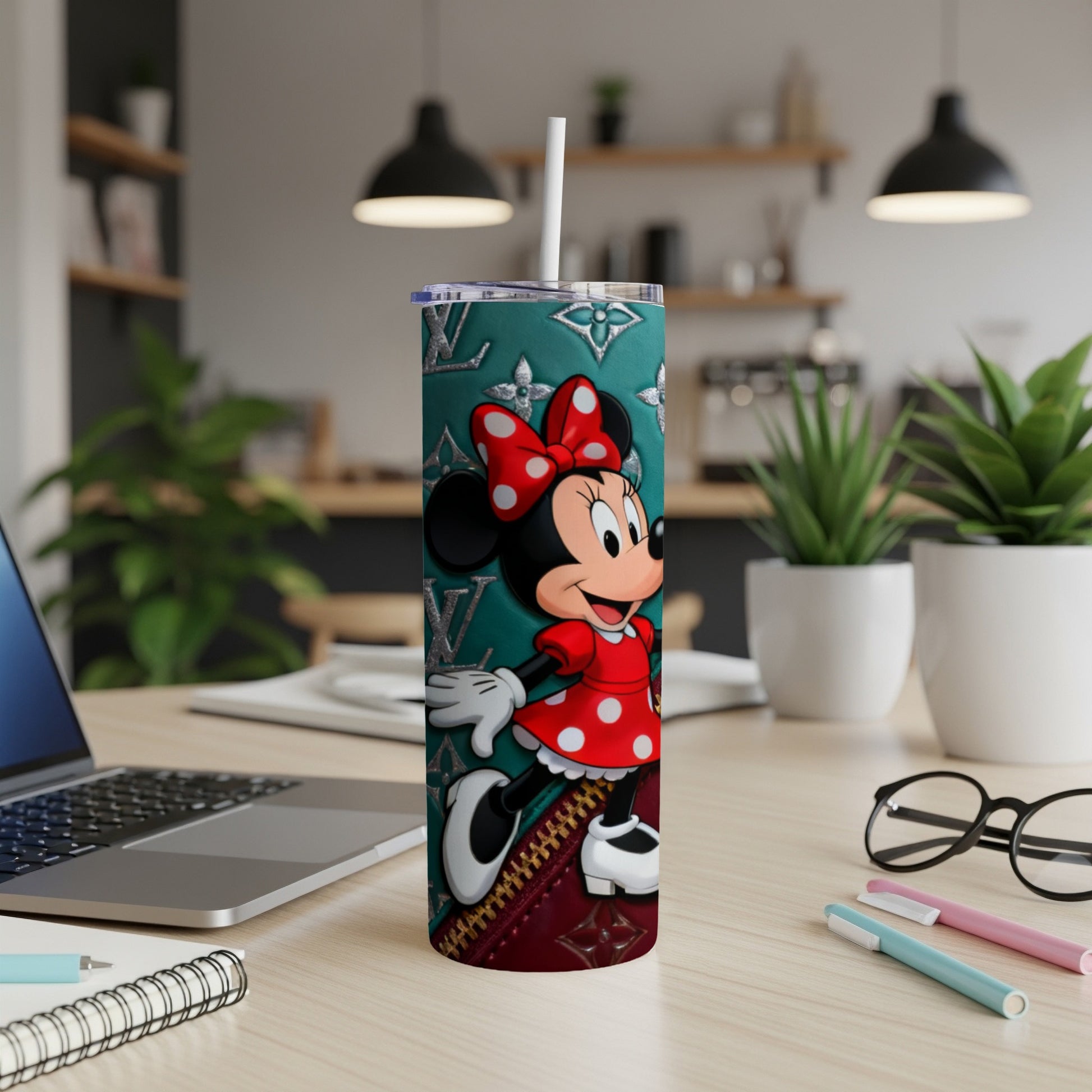 Minnie Mouse on a teal tumbler with red polka dot dress and bow.