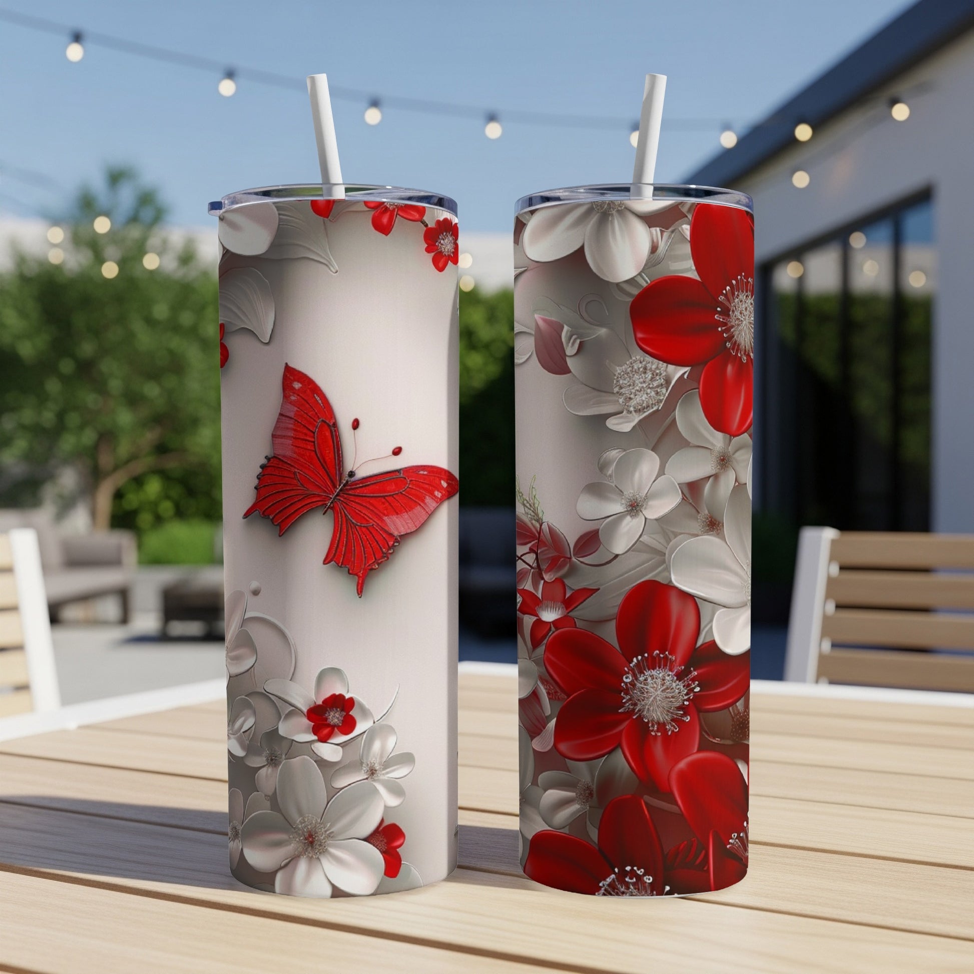 Two tumblers with a red butterfly and red and white flowers design.
