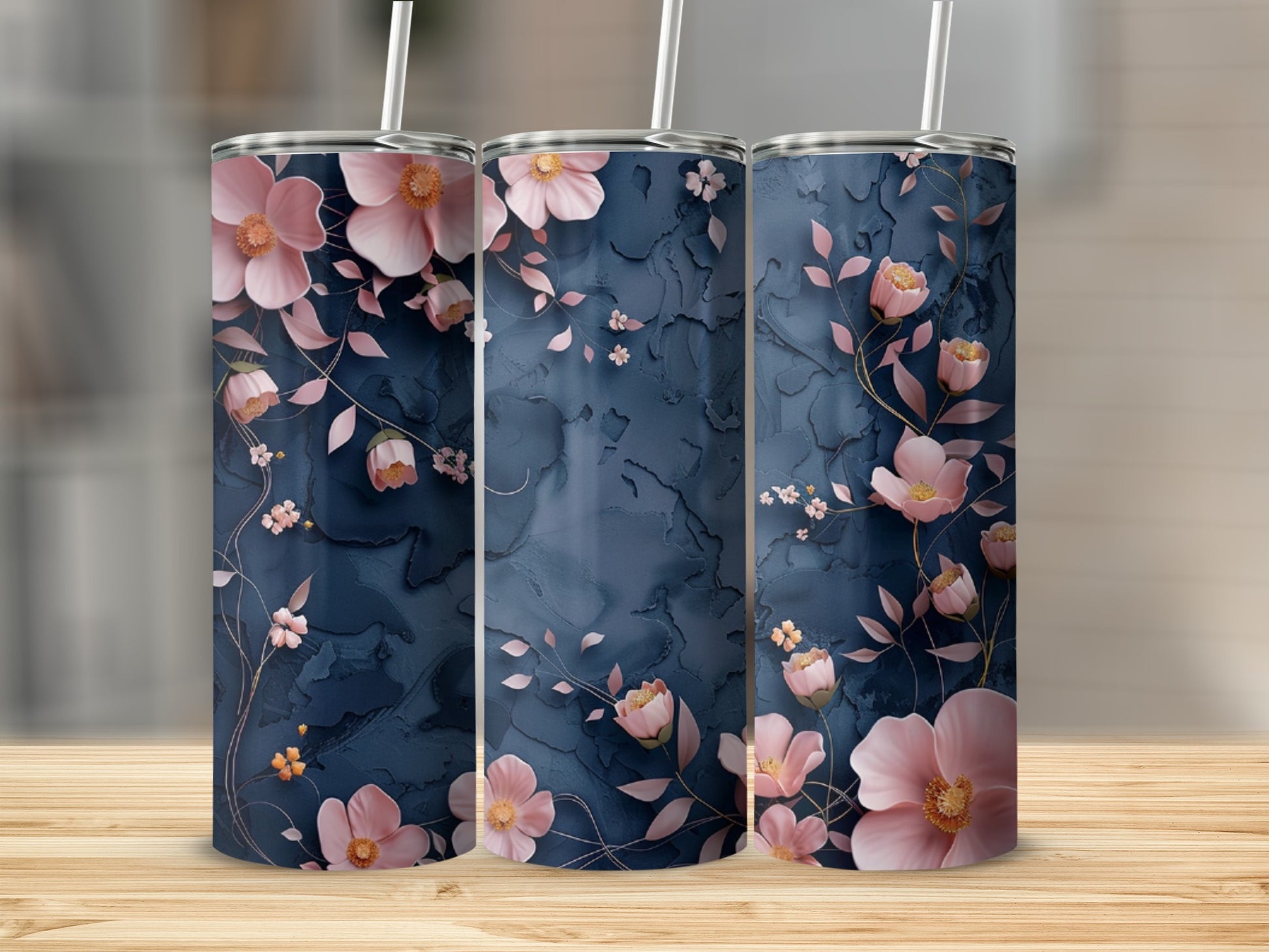 Three tall tumblers with a dark blue floral design.