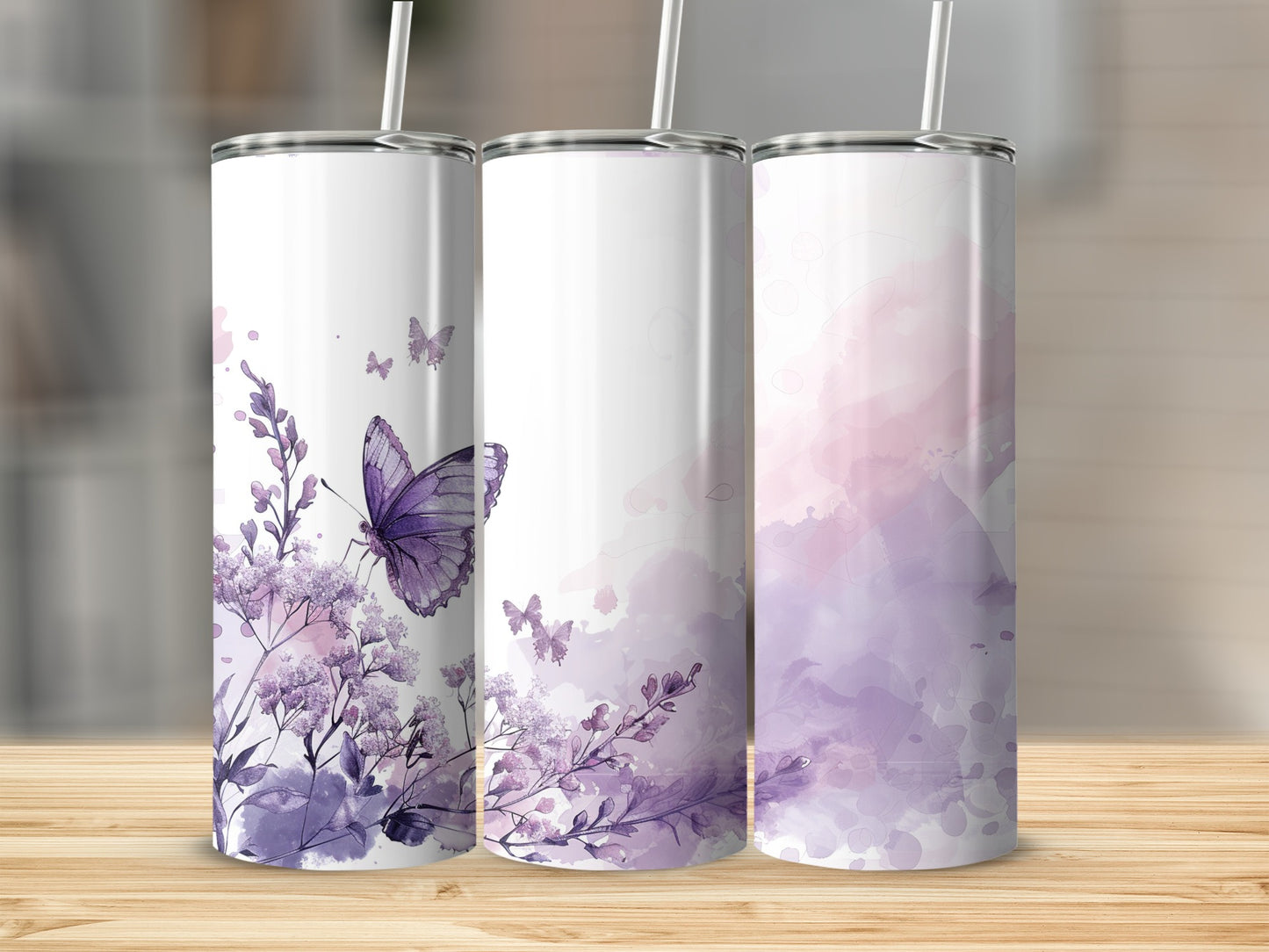 Three tumblers with purple butterflies and floral accents.