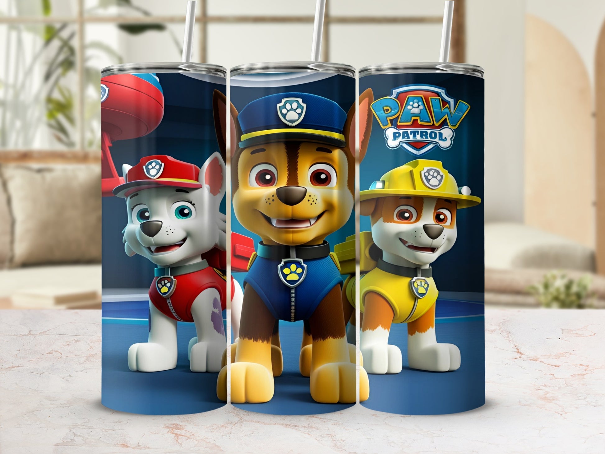 Paw Patrol characters Chase, Marshall, and Skye on a blue and white tumbler.