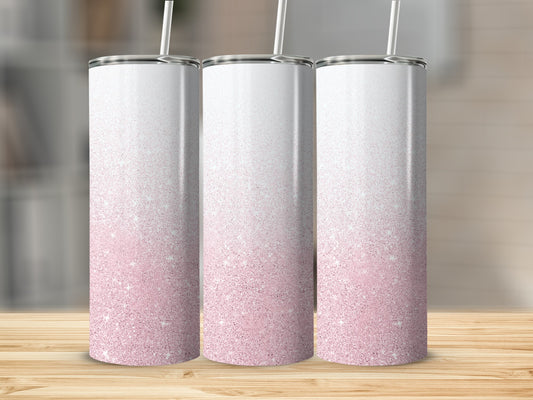 Three skinny tumblers with pink glitter gradient and white tops.