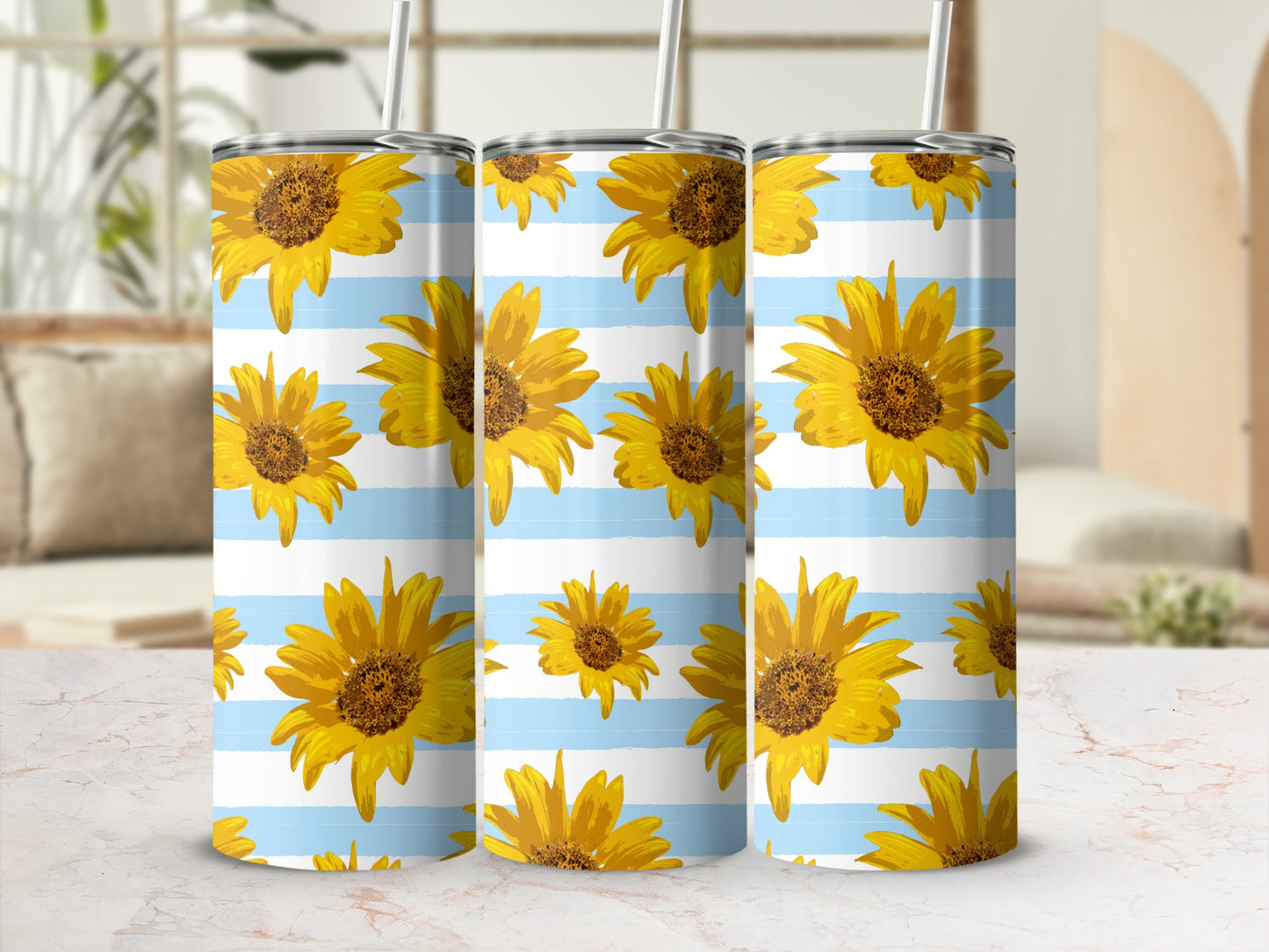 Three tumblers with a sunflower and blue stripe pattern, seen from the front.