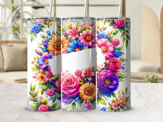 Floral tumbler with colorful flowers and a white blank space.