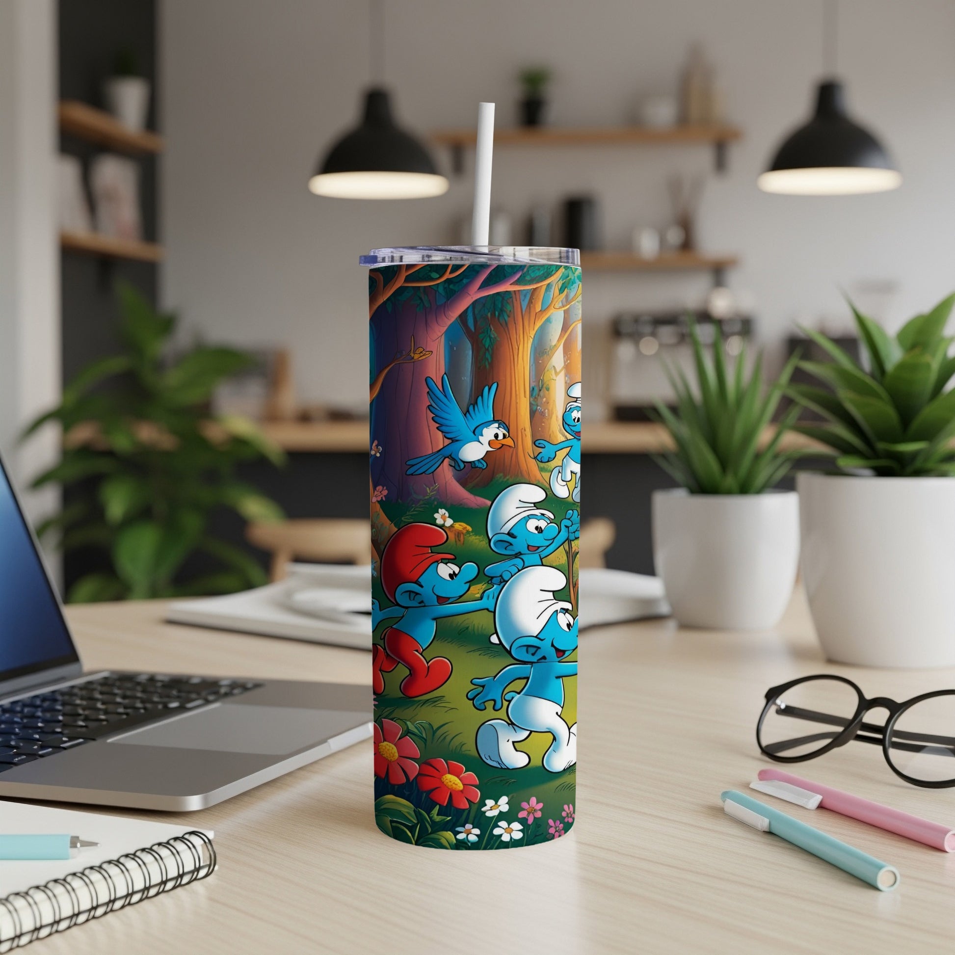 The Smurfs are gathered in a colorful forest scene on a stainless steel tumbler.