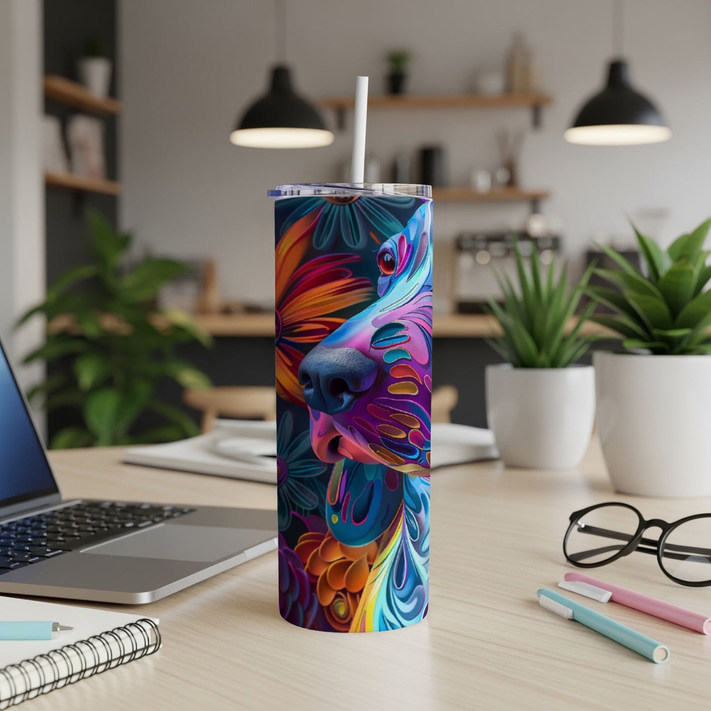Colorful abstract dog portrait on a stainless steel tumbler with straw.