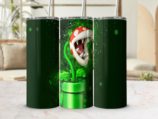 Green tumbler with Piranha Plant from Mario, straw, and abstract green background.