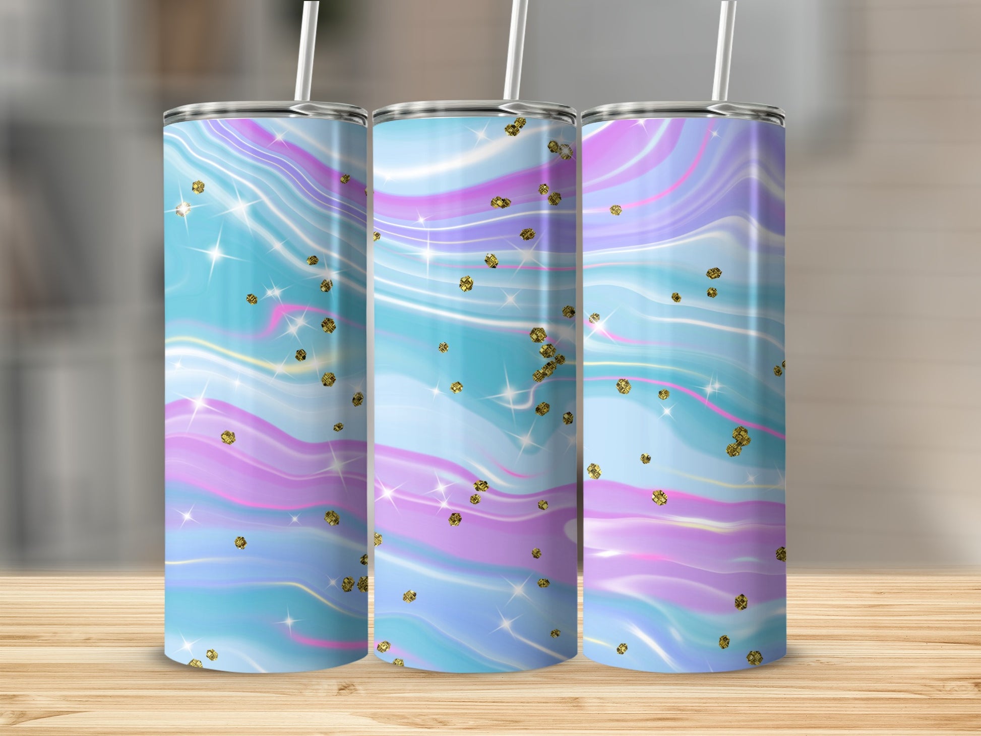 Three tumblers with pastel marble design and gold glitter accents.