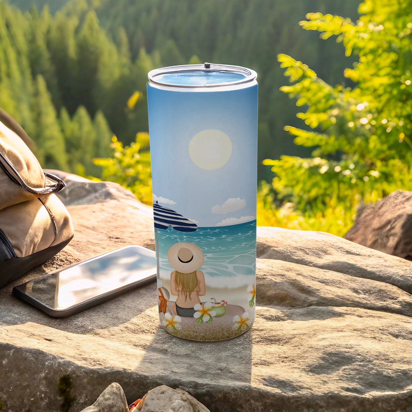 Beach scene tumbler with woman, umbrella, and drink on a rock.