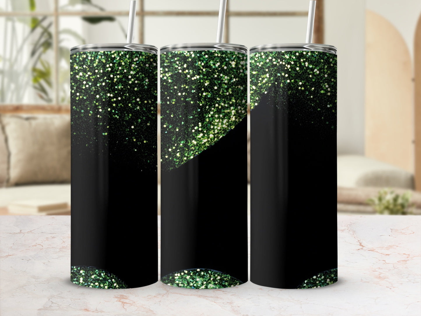 Three black tumblers with green glitter at the top.