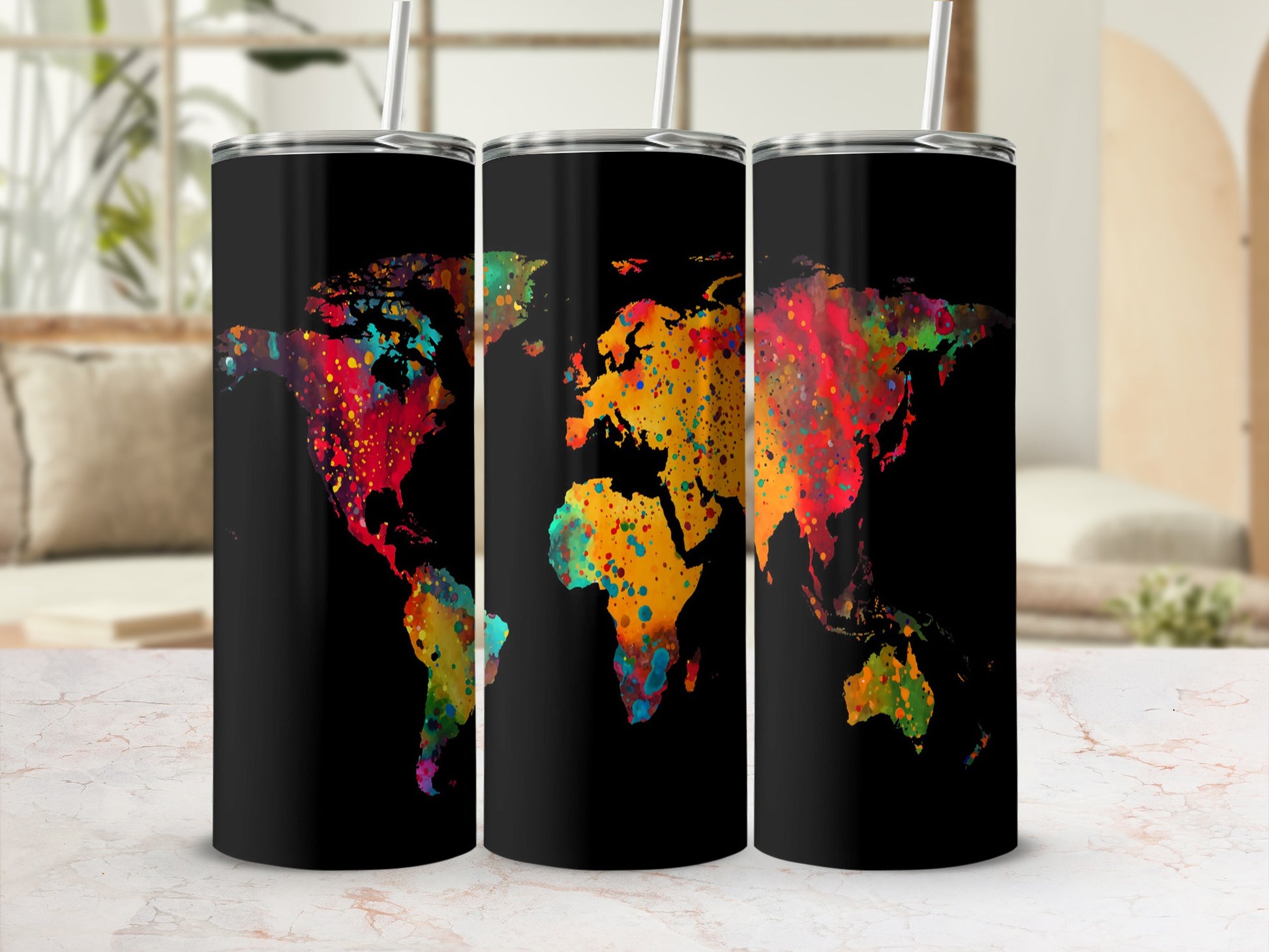 Three tumblers with colorful splattered world map design on black background