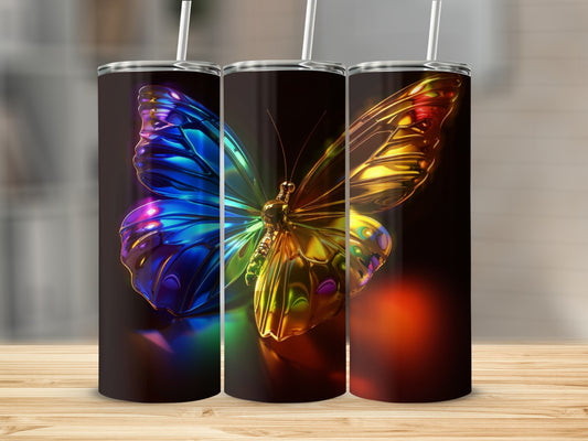Three iridescent butterfly tumblers with straws on a wooden surface.