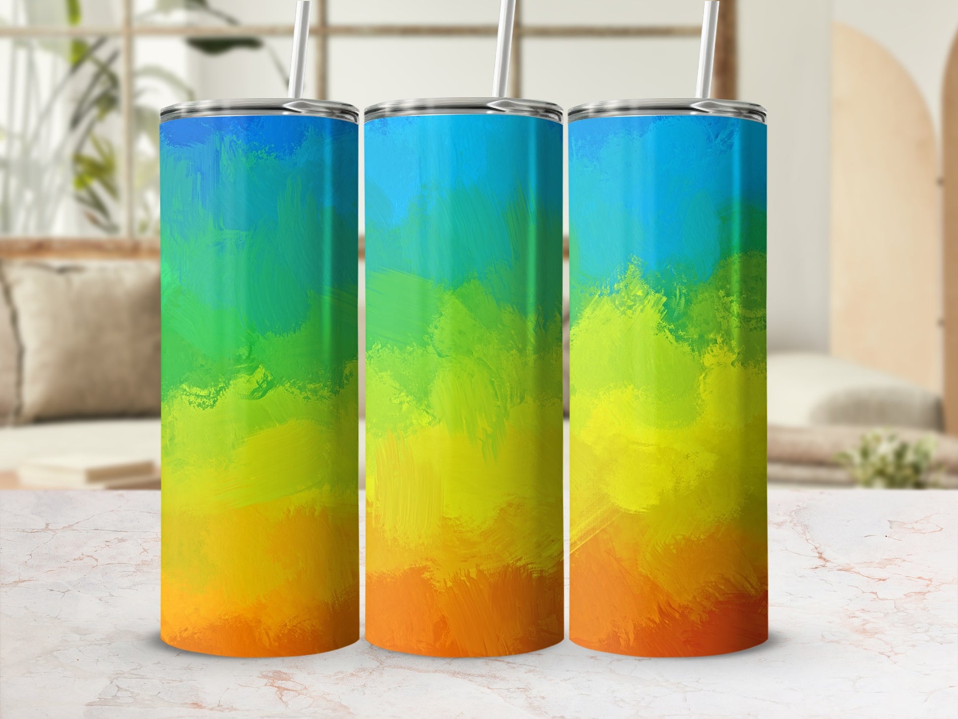 Three tumblers with a colorful abstract gradient design of blue, green, yellow, and orange.
