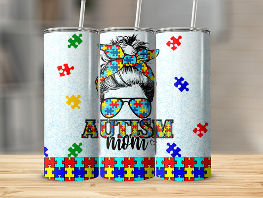Autism Mom tumbler with puzzle piece pattern and colorful bandana.
