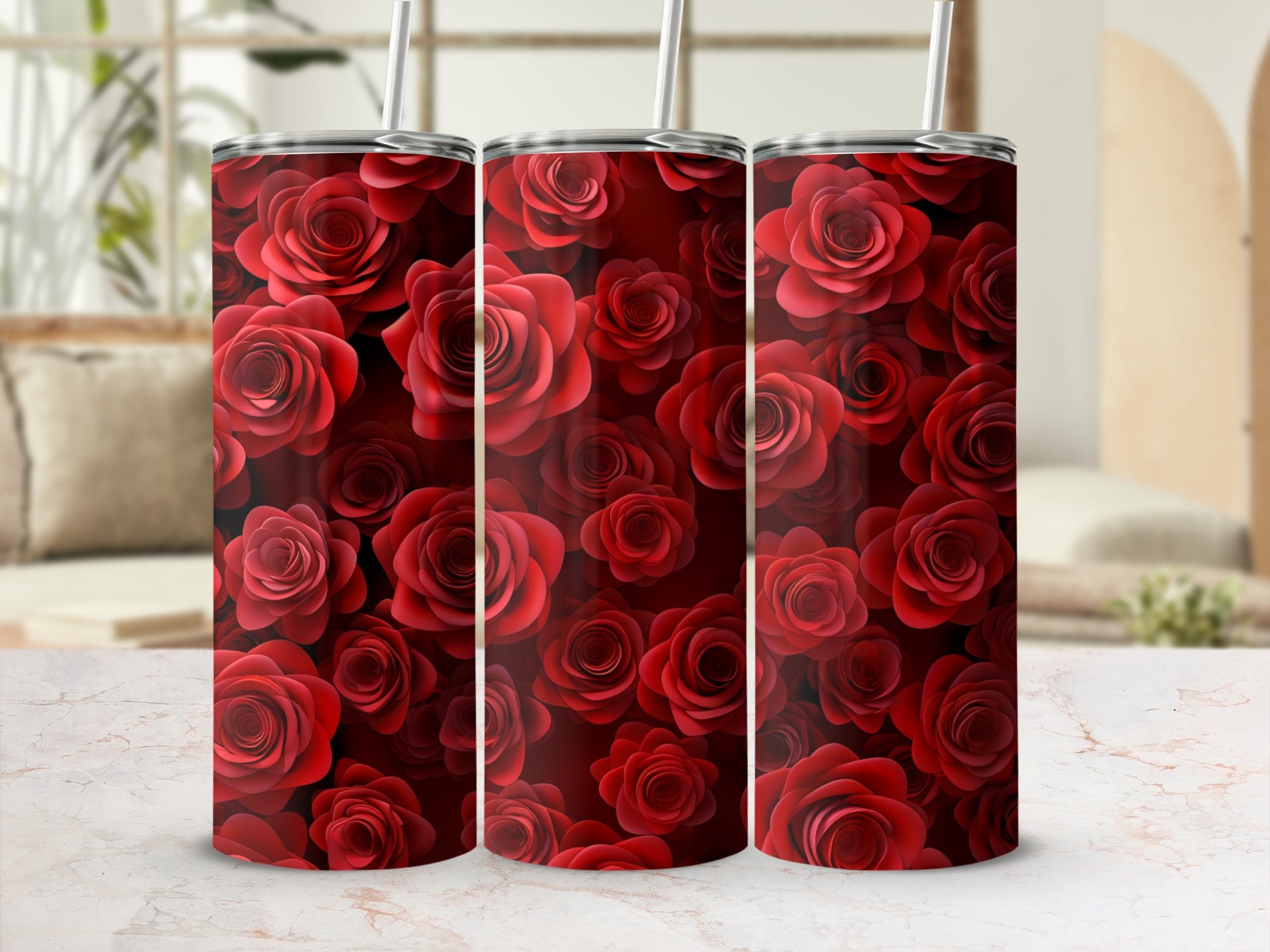 Three tumblers adorned with a repeating pattern of red roses.