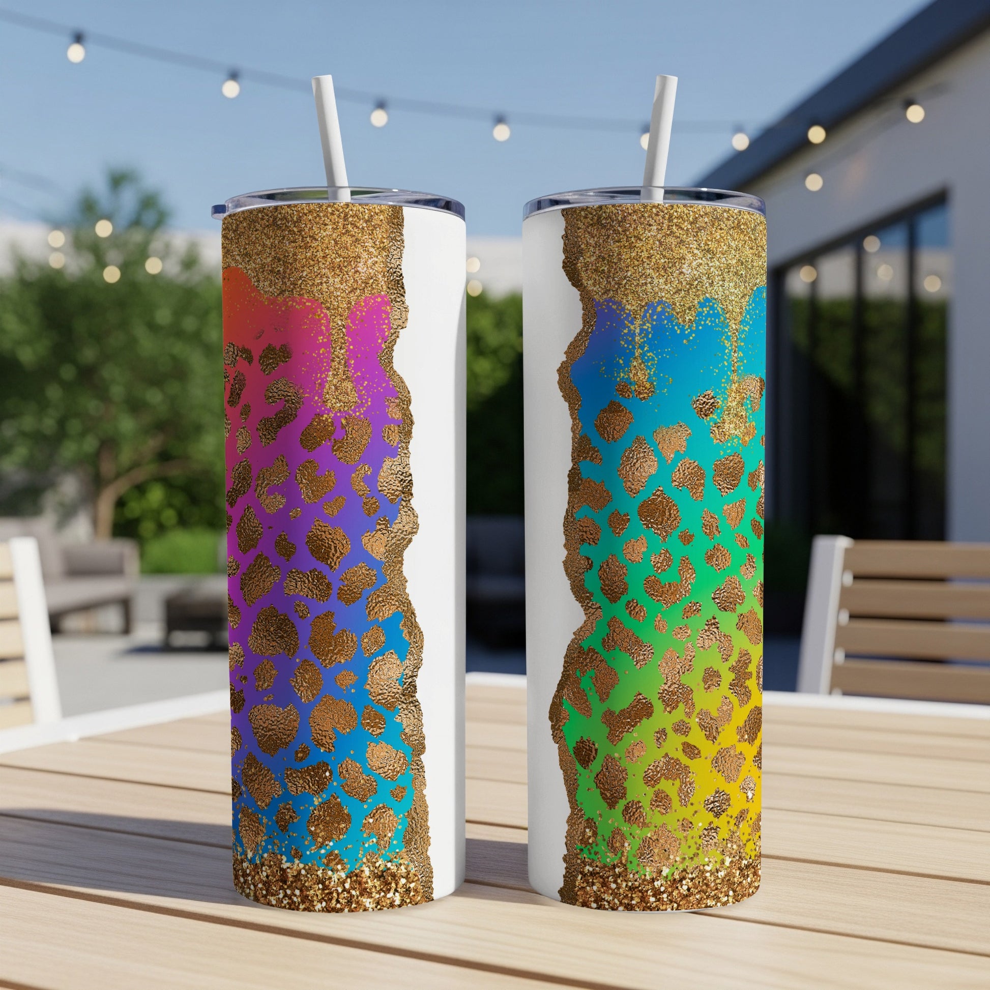 Two white tumblers with leopard print and rainbow glitter detail.