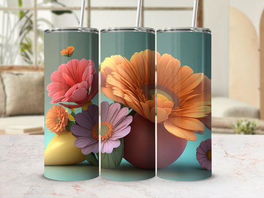 Three tumblers featuring colorful floral designs and pastel hues.