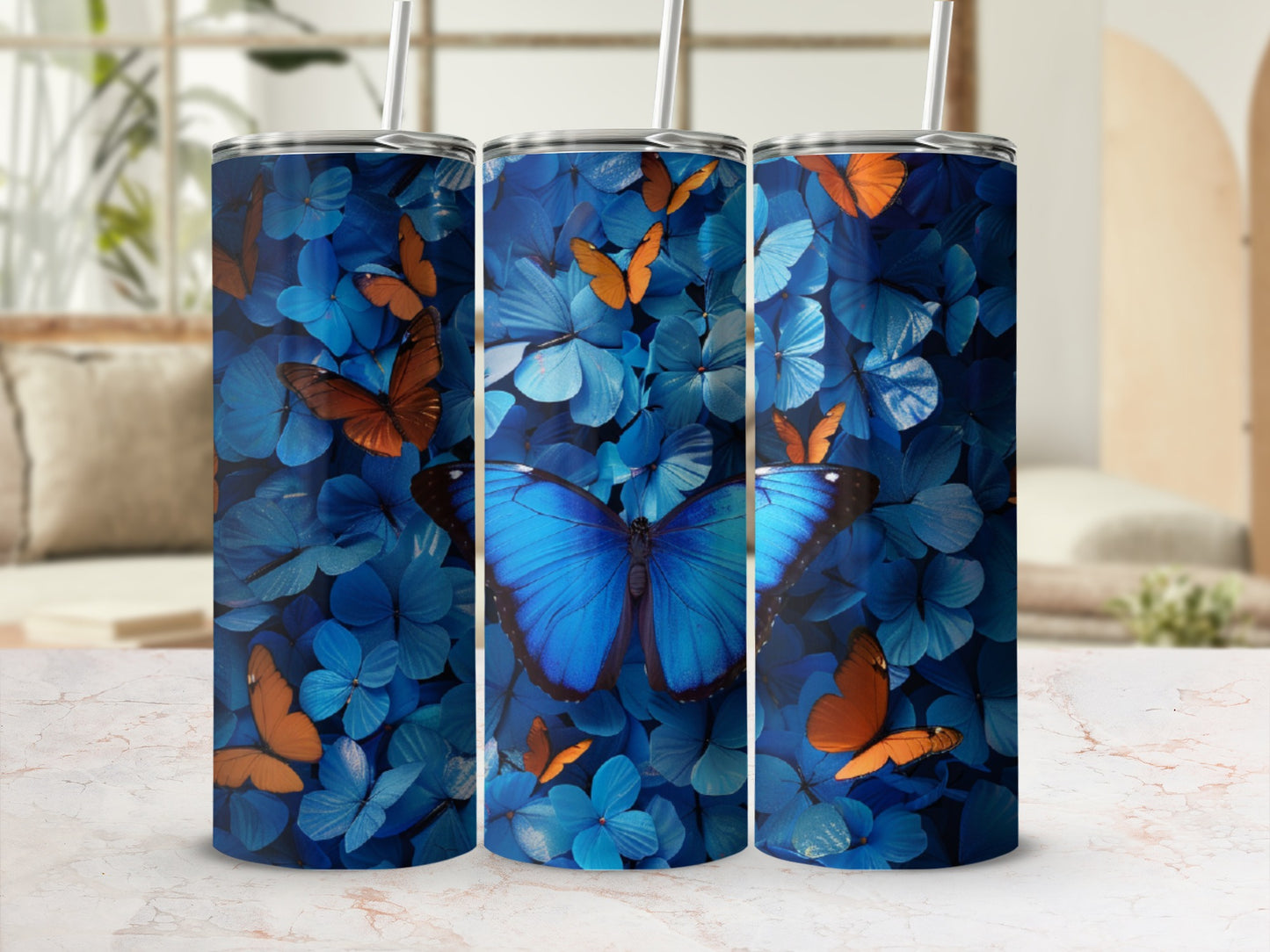 Blue and orange butterflies on a blue floral background, displayed on a tumbler.