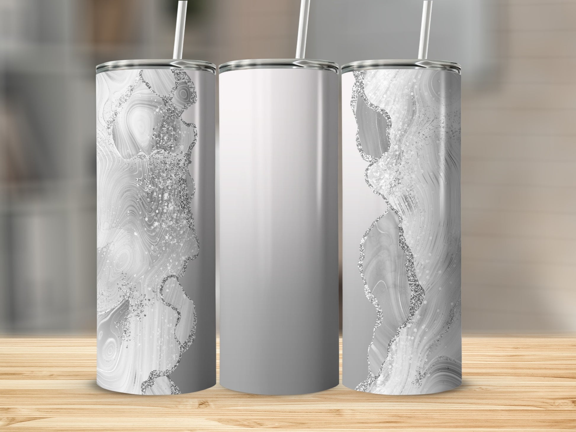 Three tumblers with a white marble and silver glitter design.