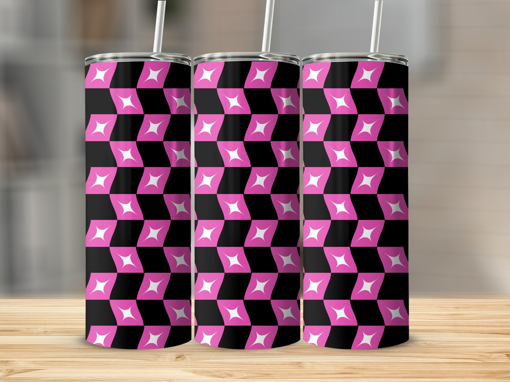 Three tumblers with a pink and black geometric diamond pattern.
