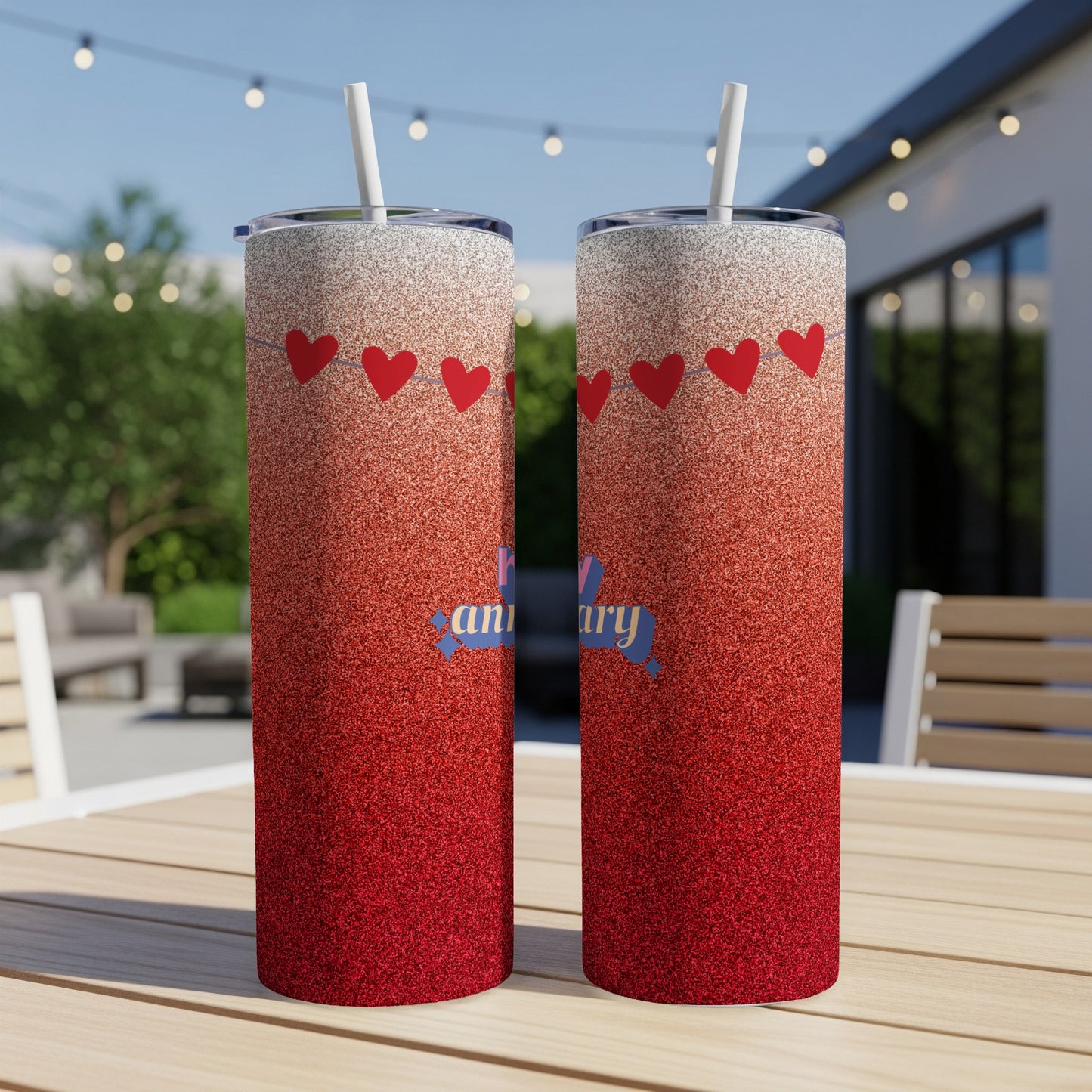 Red glitter tumbler with "Happy Anniversary" text and heart garland design.