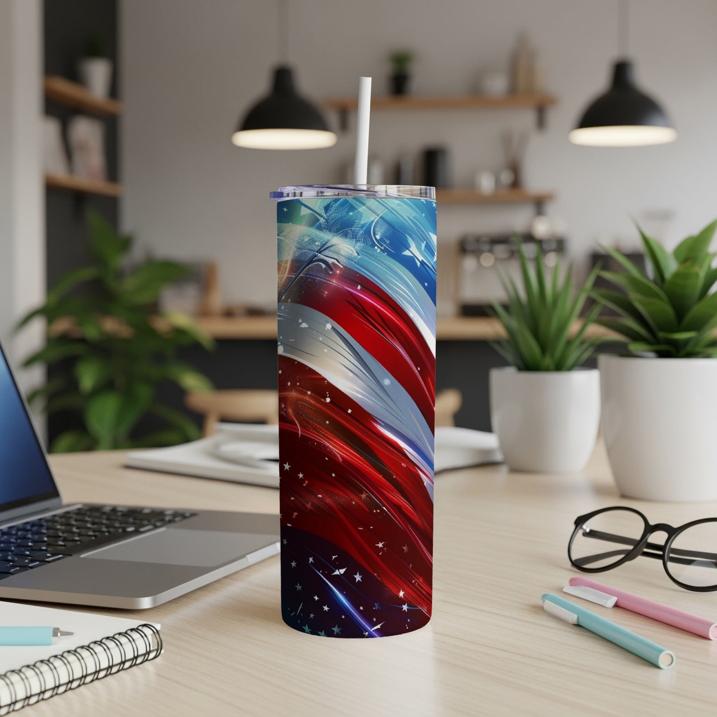Tall tumbler with American flag design on wooden desk.