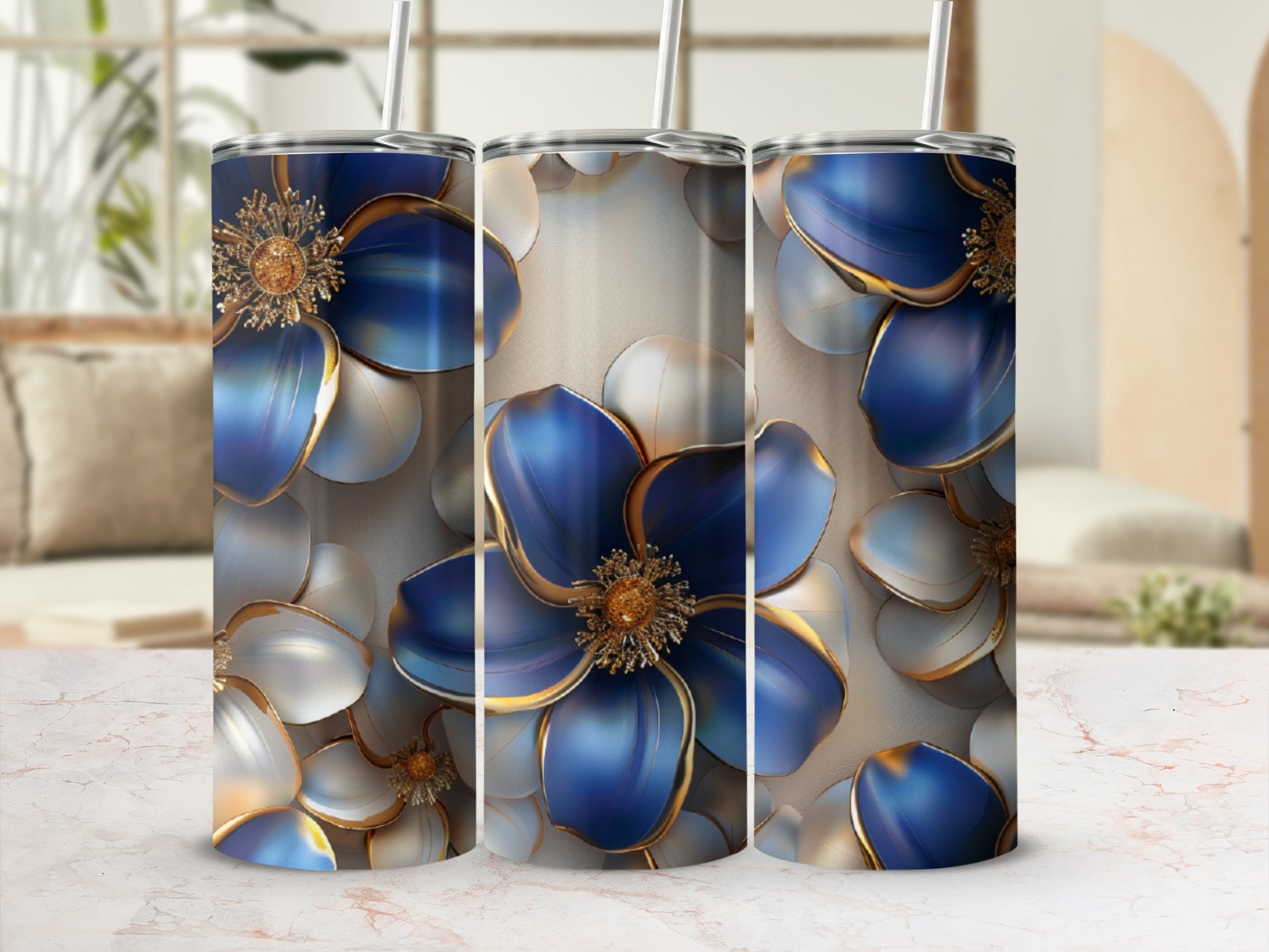 Three tumblers featuring blue and gold floral designs on a textured background.