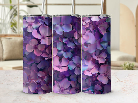 Floral tumbler with purple and pink petals and a straw.