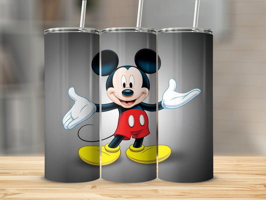 Three tumblers with Mickey Mouse design on a wooden surface.