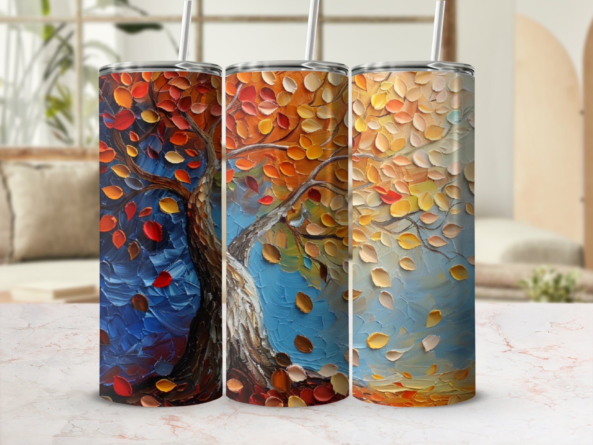 Three tumblers with a textured tree and falling leaves painting design.