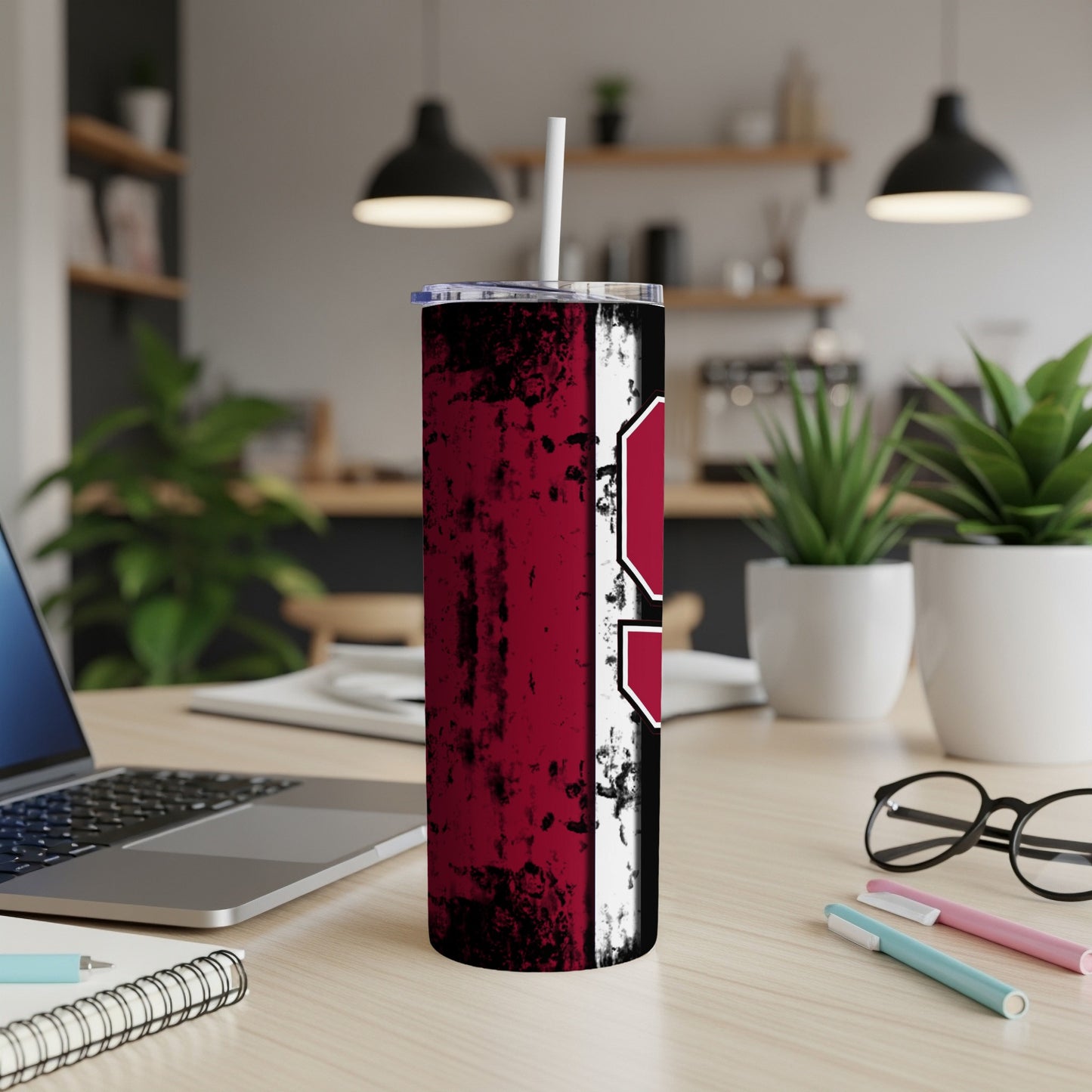 Maroon and white striped tumbler with a distressed finish and a white straw.